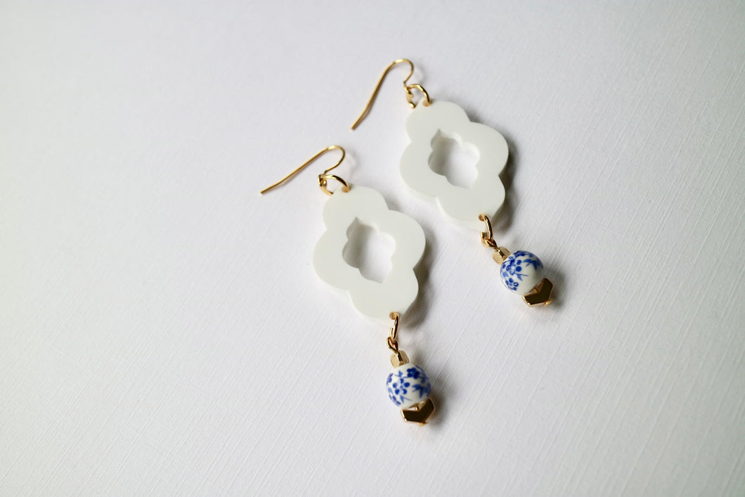 White pretties with blue bead