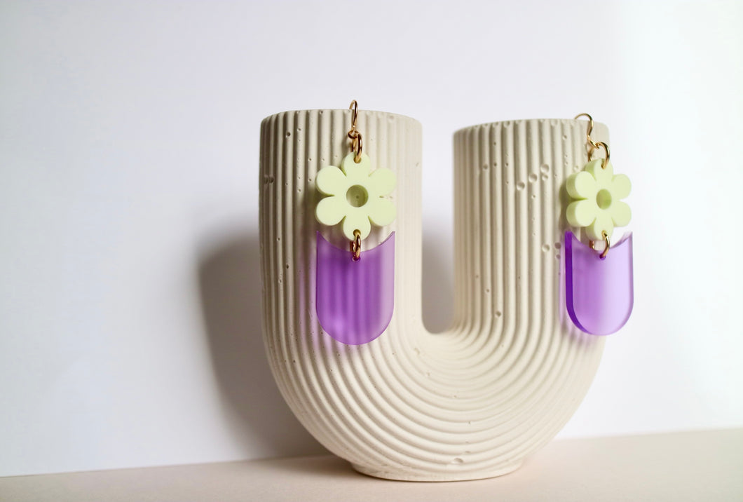 Frosty purple bottom earrings with matte yellow daisy topper